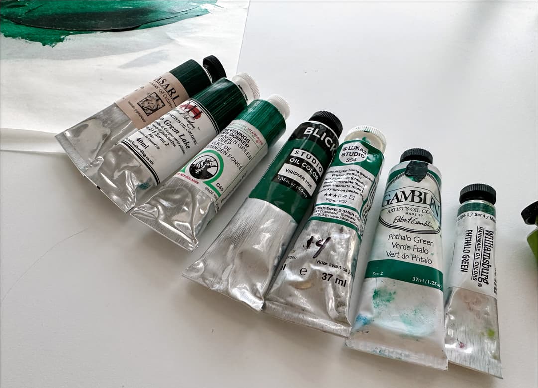 Seven tubes of phthalo green oil paint