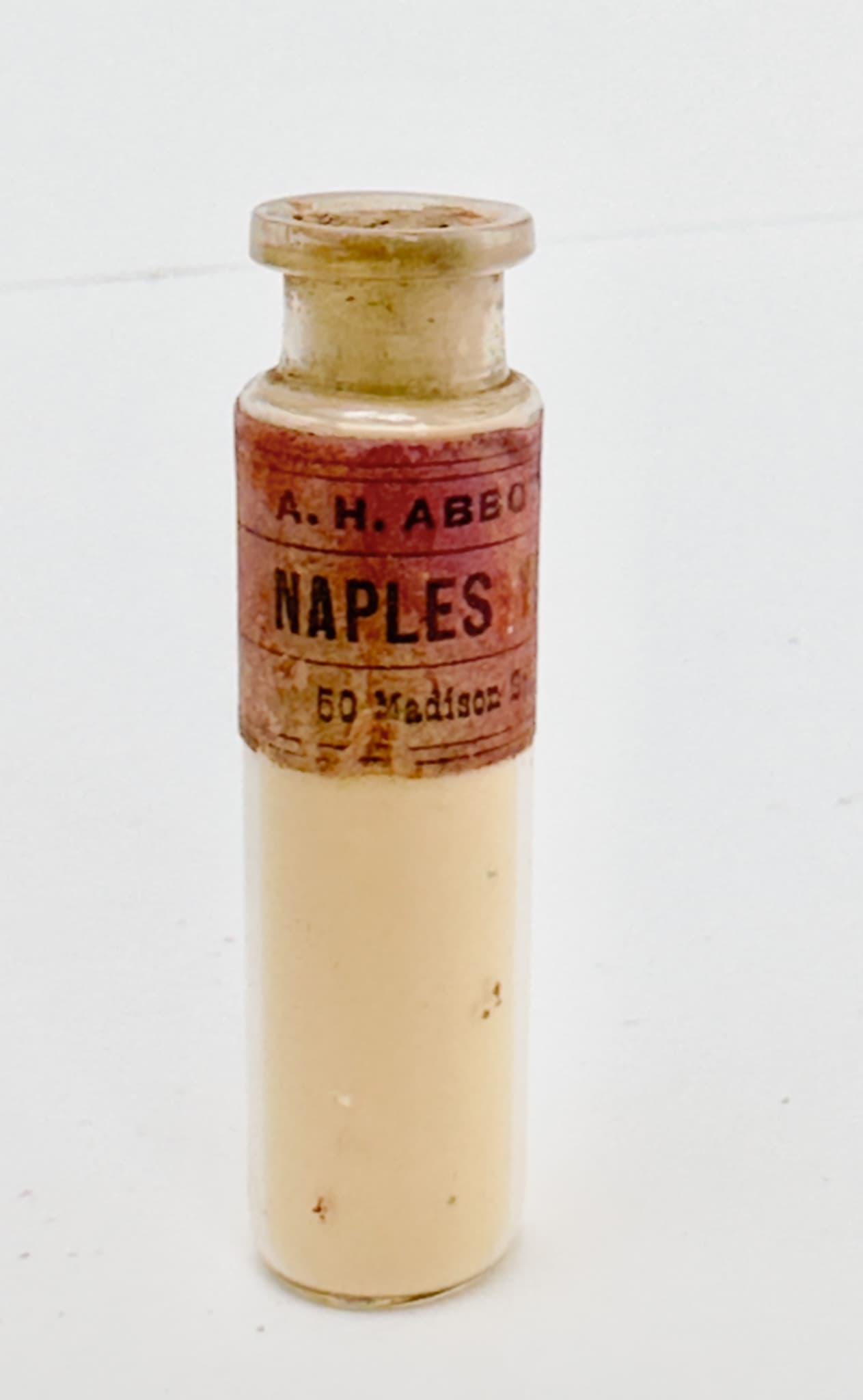 An antique vial of Naples Yellow pigment