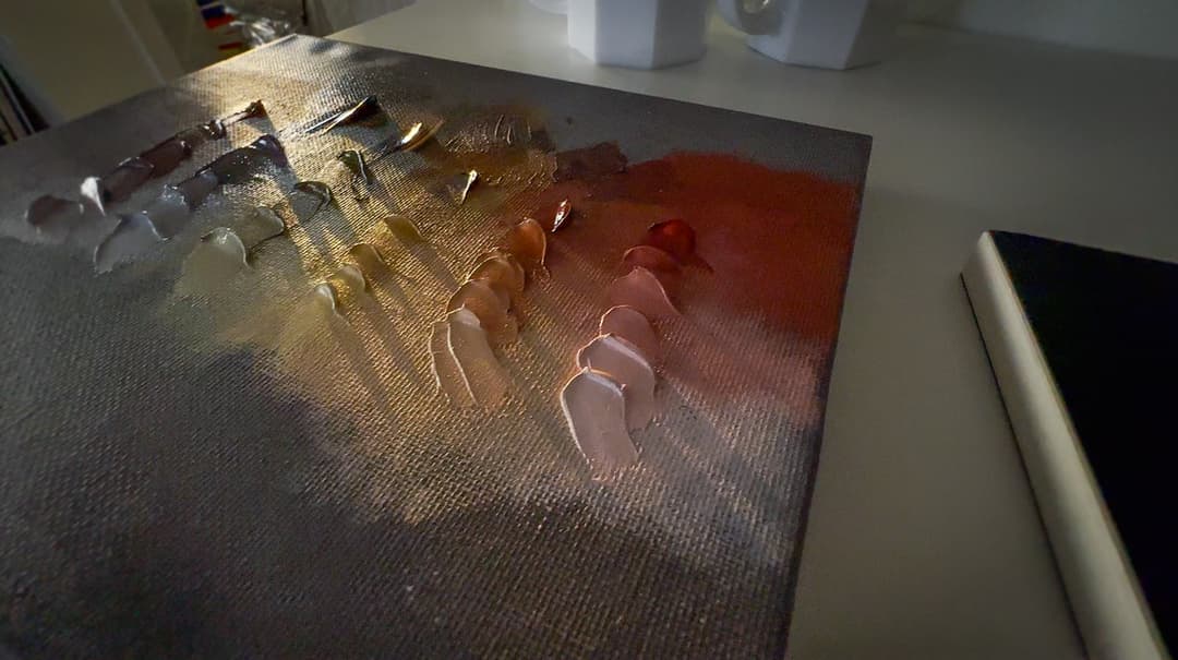 Late afternoon light shining on a canvas with paint
