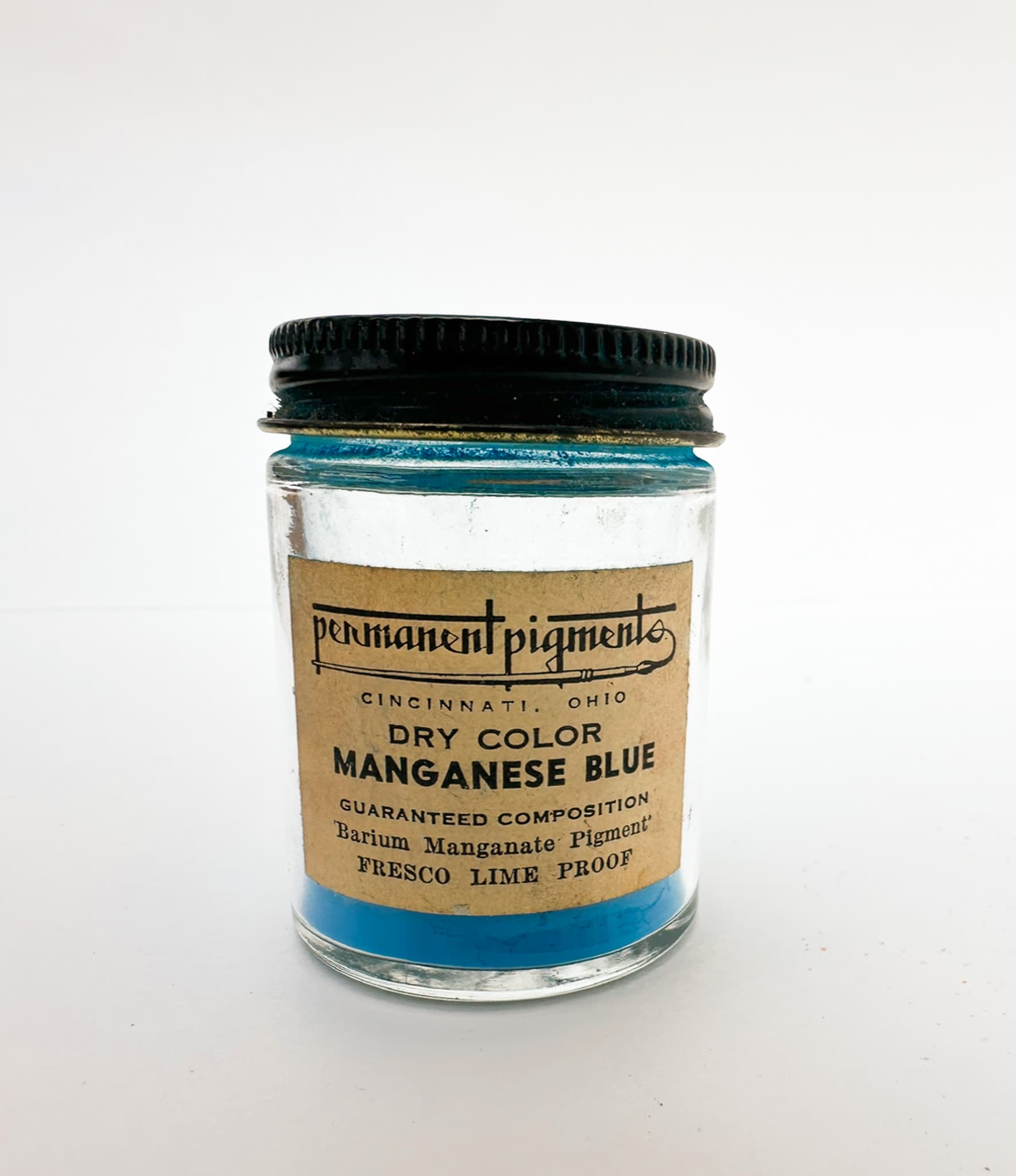A jar of authentic vintage Manganese Blue pigment