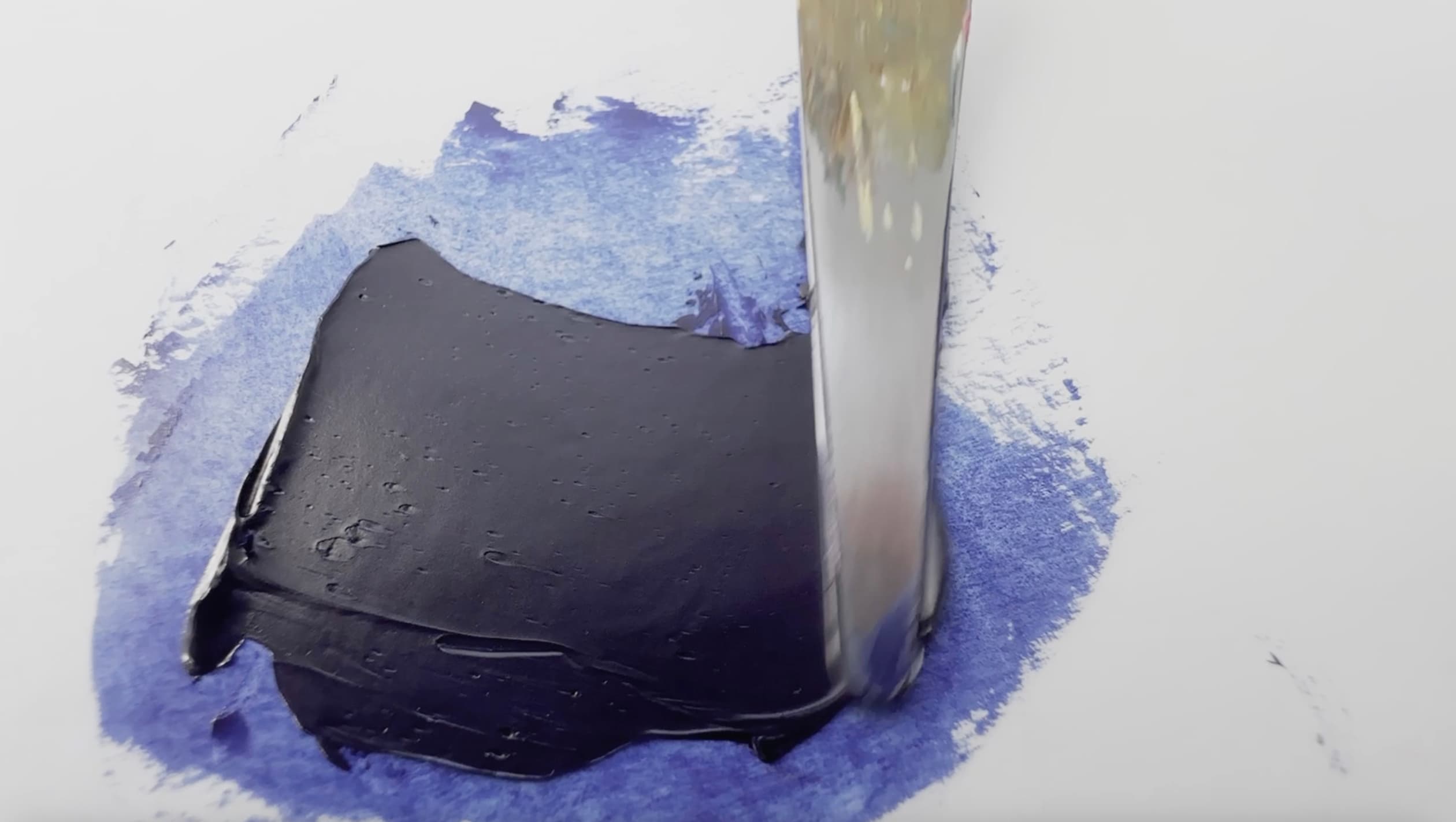 A bit of Indanthrone Blue oil paint pulled by a palette knife