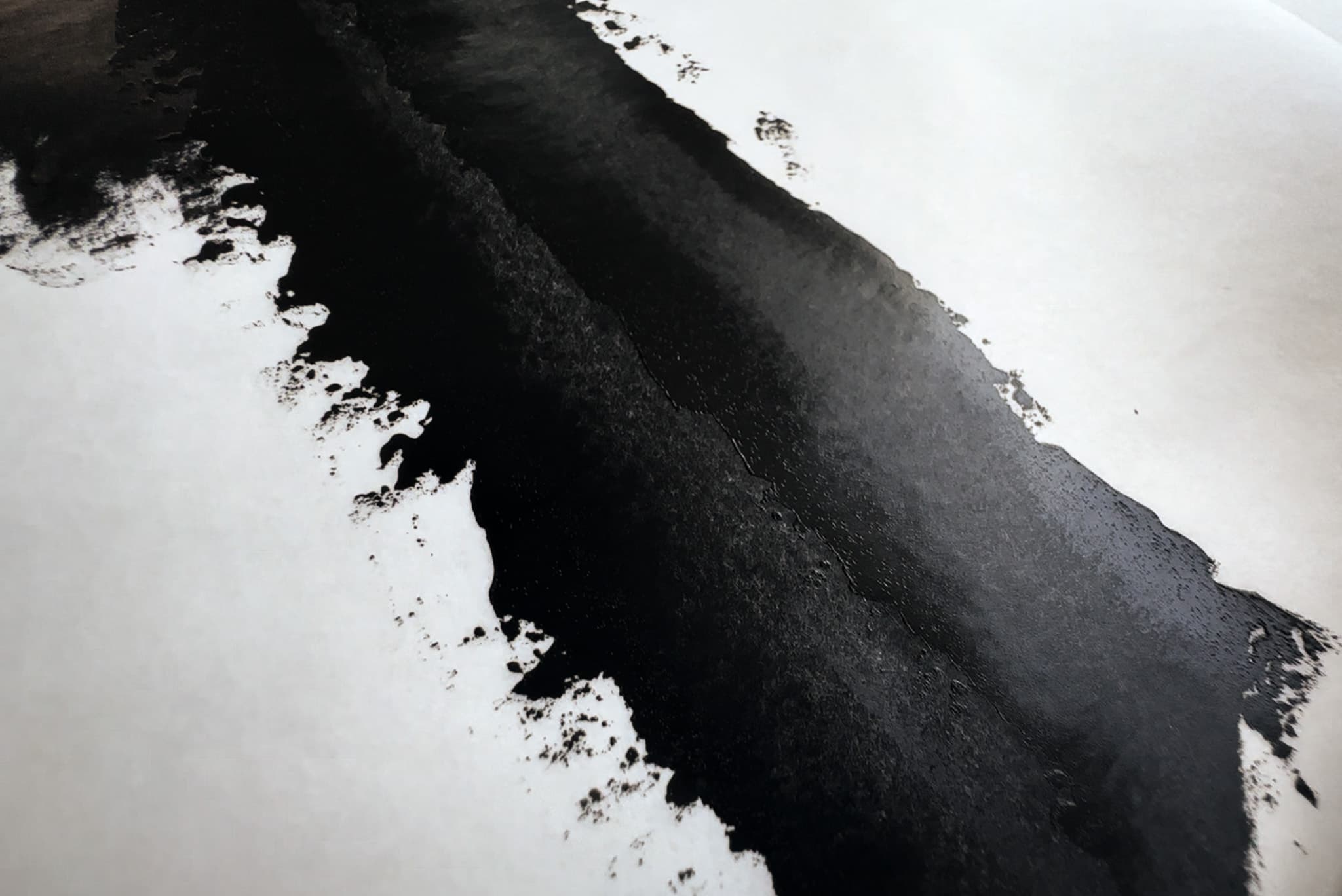 A coat of Holbein Peach Black Oil paint made with a palette knife