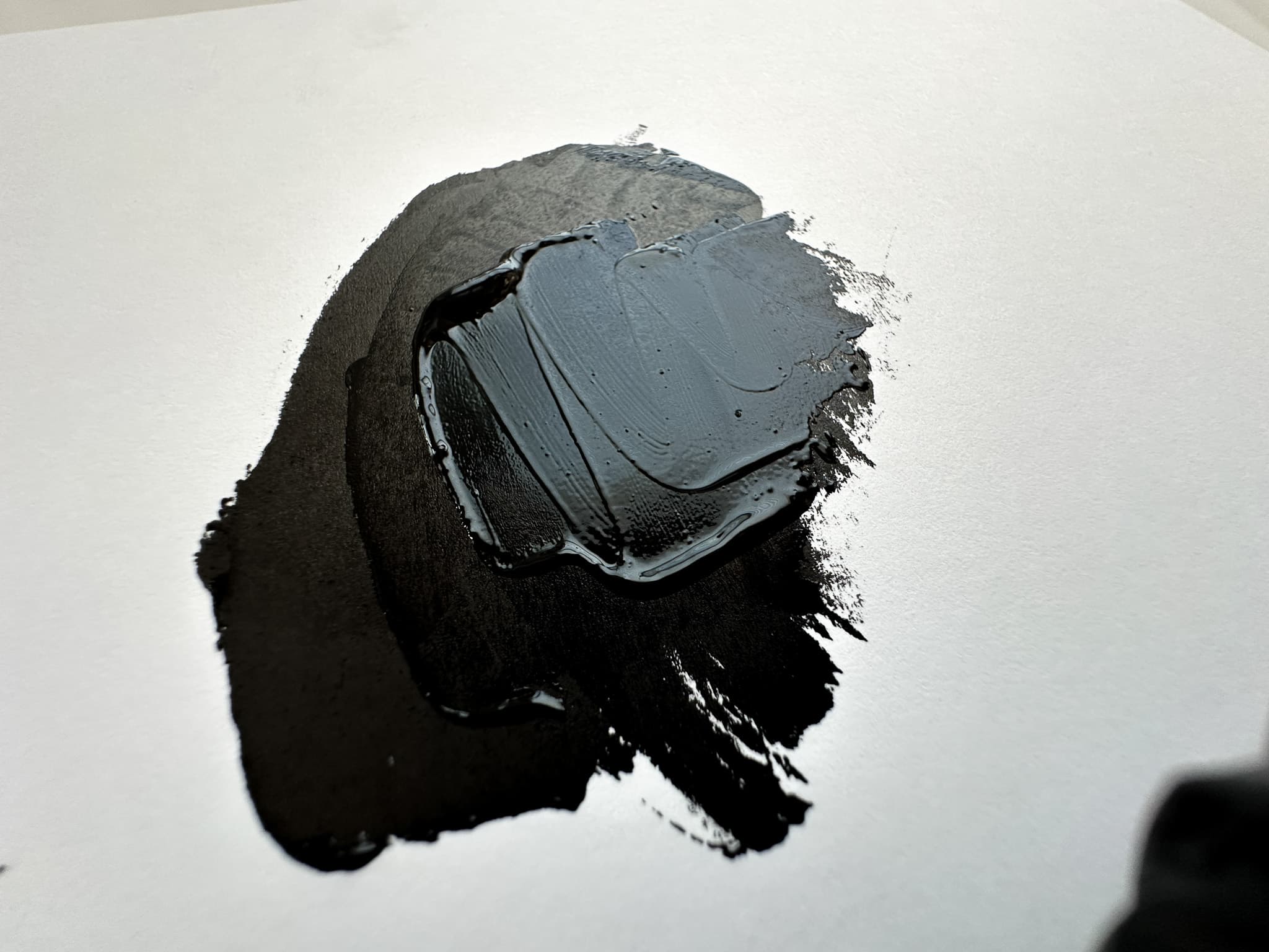 A daub of Maimeri Puro Carbon Black in oil paint