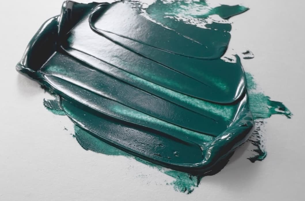 An impasto swoosh of viridian oil paint