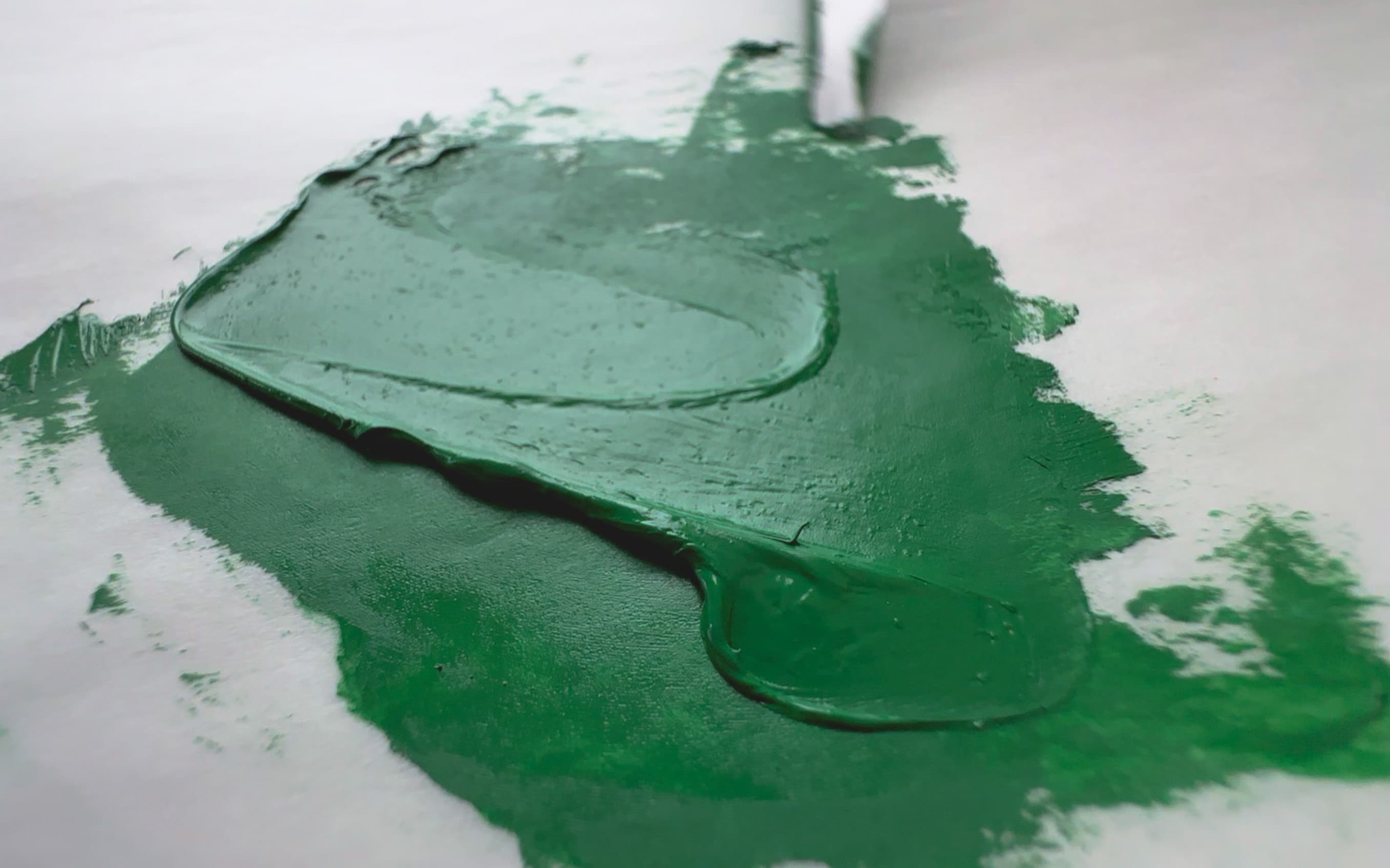 A swoosh of rich green oil paint made with PG50