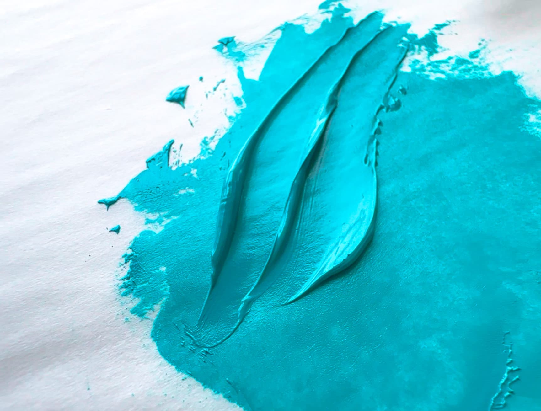 Two strokes of teal green oil paint made with PG50