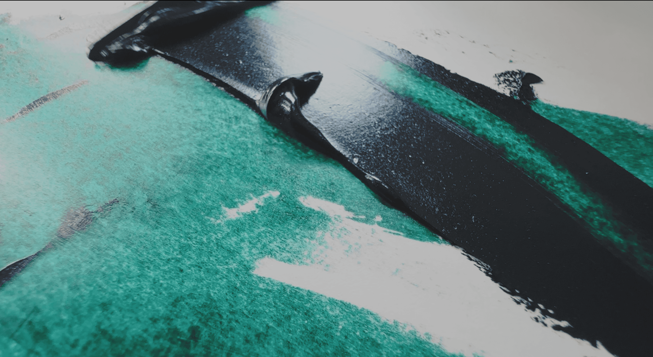 A swoosh of blue-green oil paint. In masstone it is almost black, but when thinned reveals high chroma