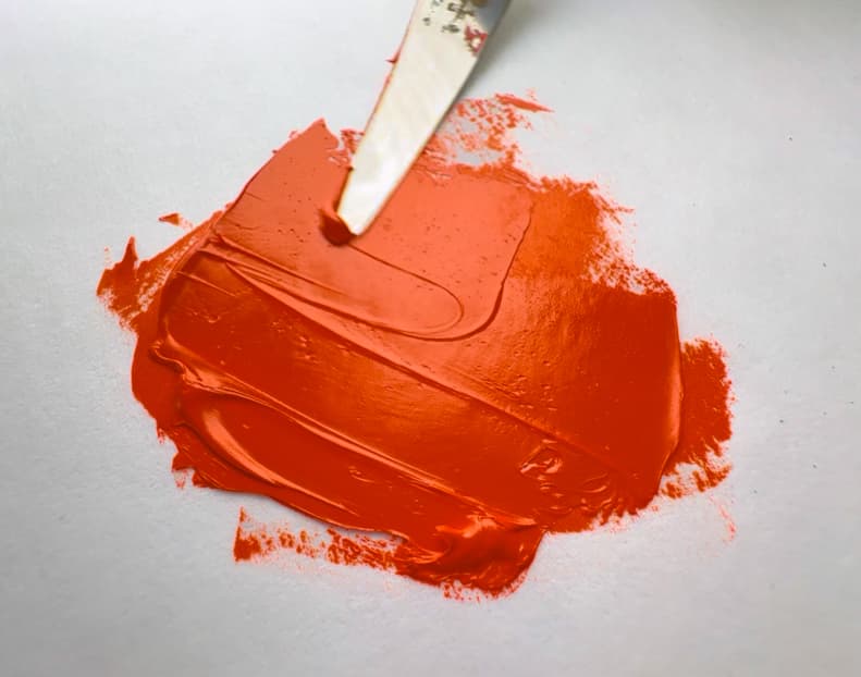 A swirl of PO67 orange oil paint