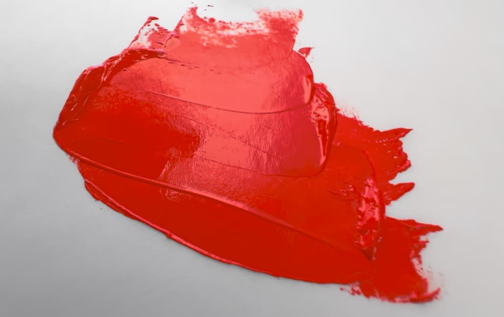 A swoosh of red oil paint made with PR113:1