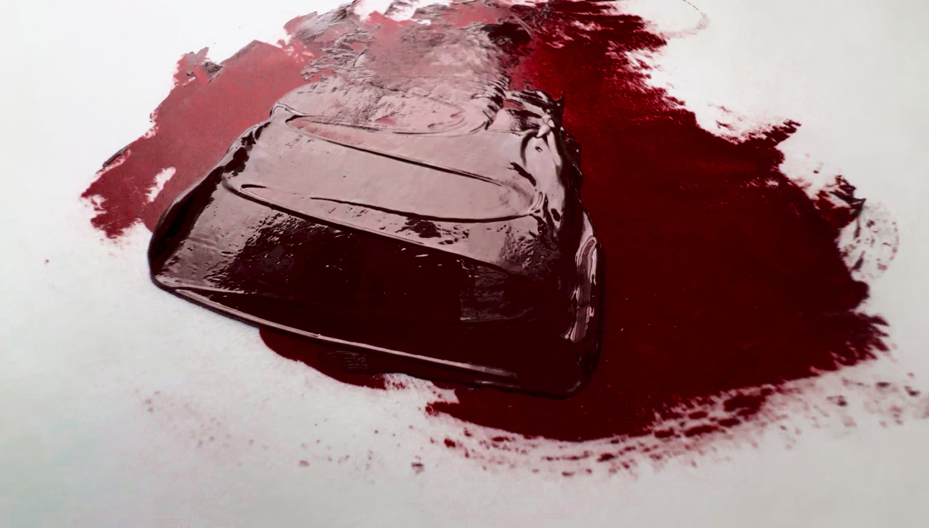 A dollop of maroon oil paint made of PR179