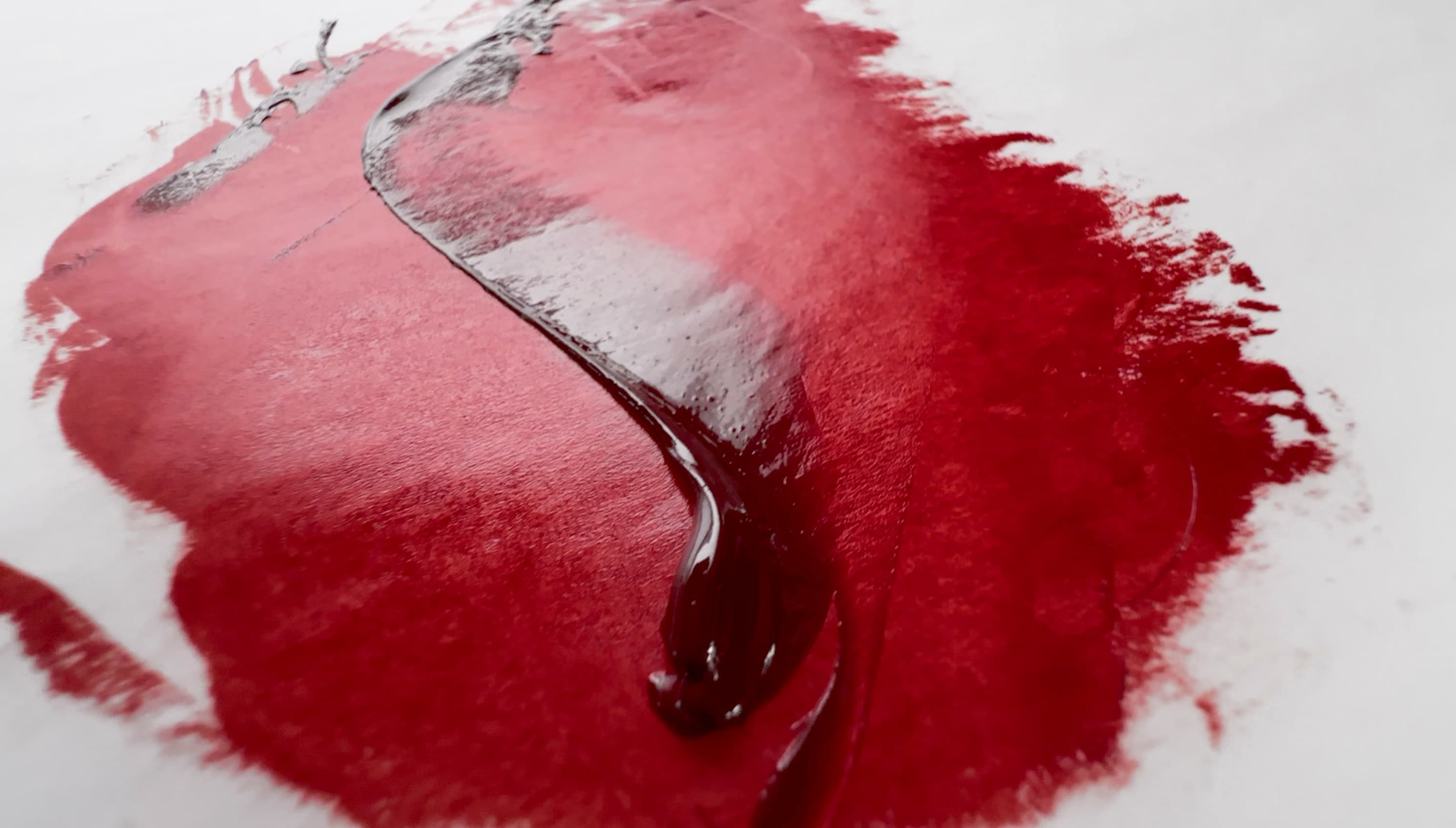 A stroke of Perylene Maroon oil paint