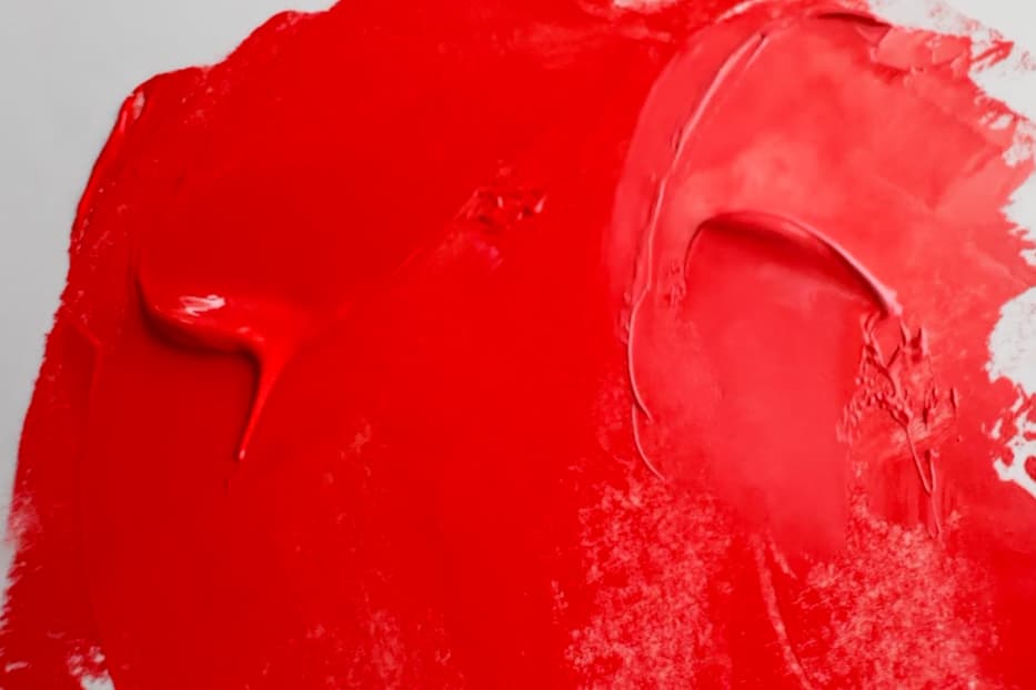 Bright red-orange oil paint with warm coral tints with white
