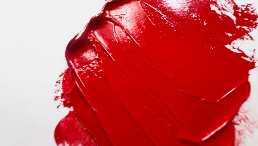 A swatch of bright red oil paint