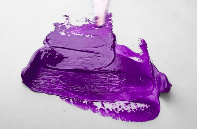 A swirl of purple oil paint made of PV14