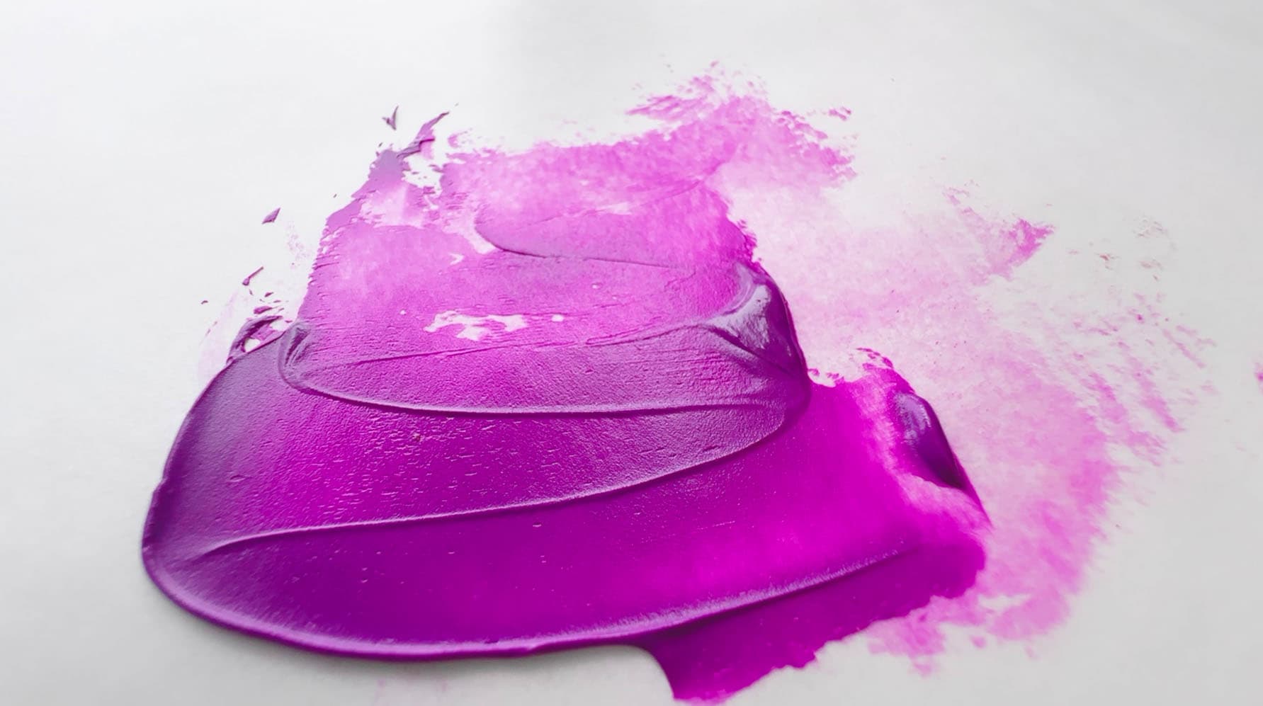 A swirl of electric purple oil paint made with cobalt violet
