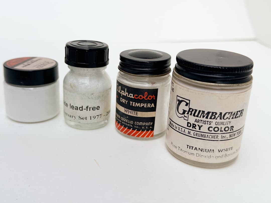 Jars of white pigment