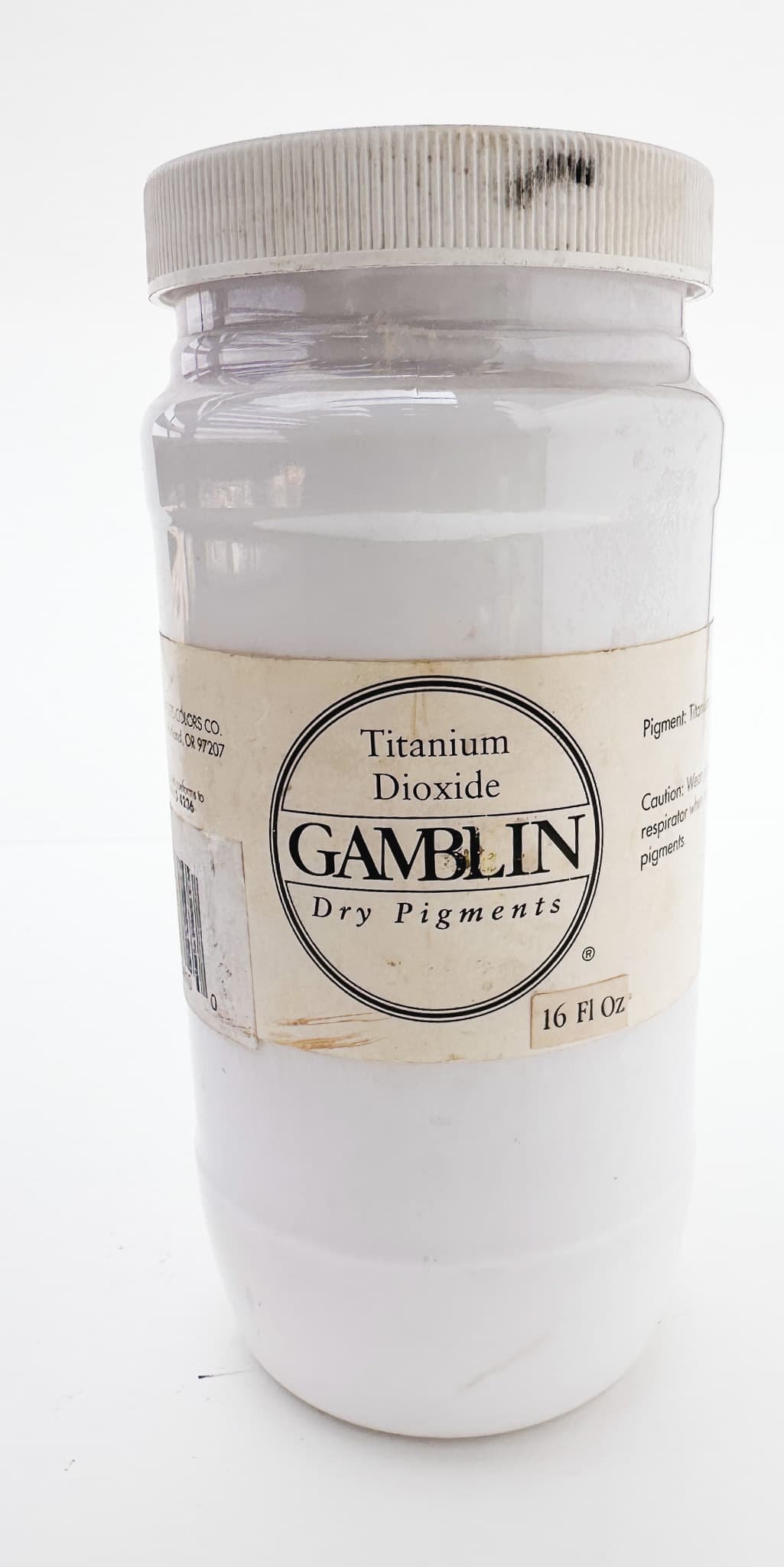 A jar of Titanium Dioxide dry pigment from Gamblin