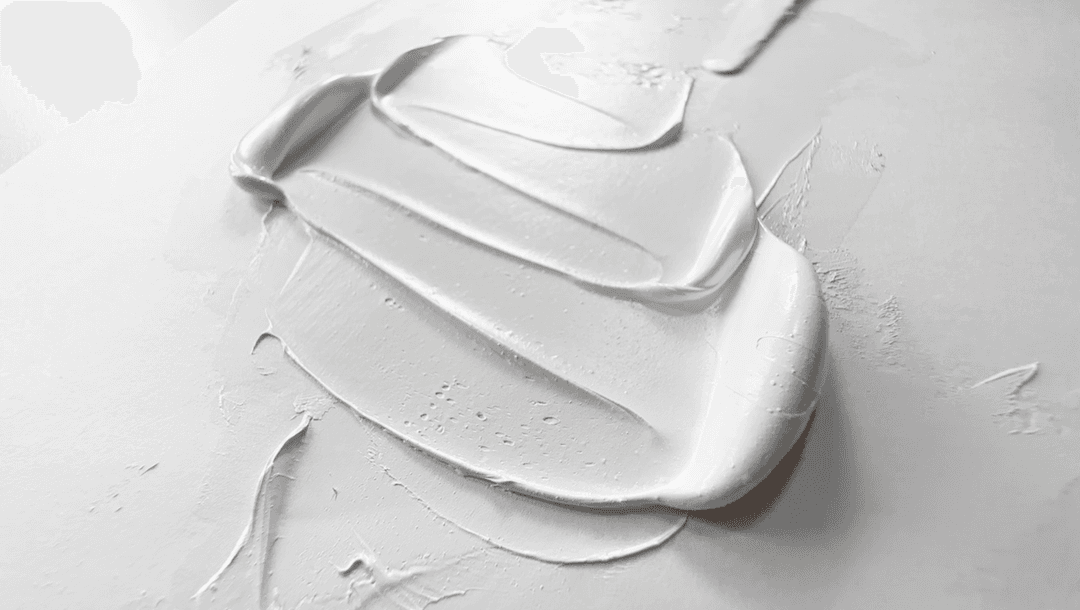 Williamsburg Titanium White in Linseed oil spread back and forth by a palette knife