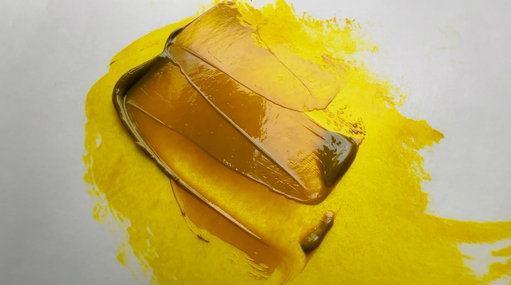 A dollop of PY150 by Mussini that shows great transparency- dark in masstone but bright yellow in glazes