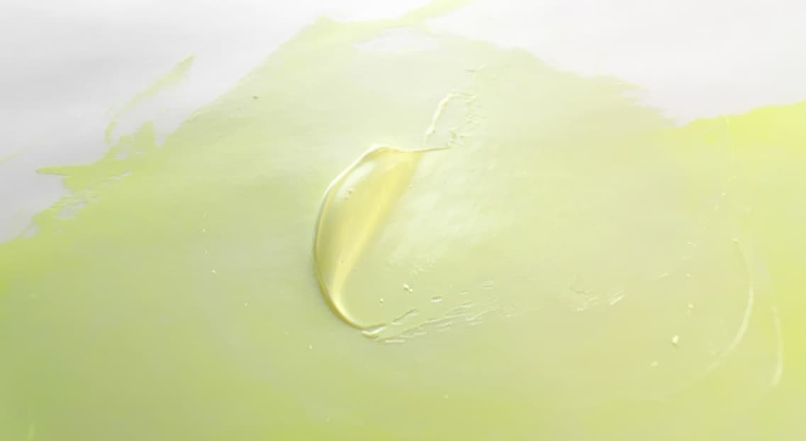 A dollop of pale yellow-green oil paint