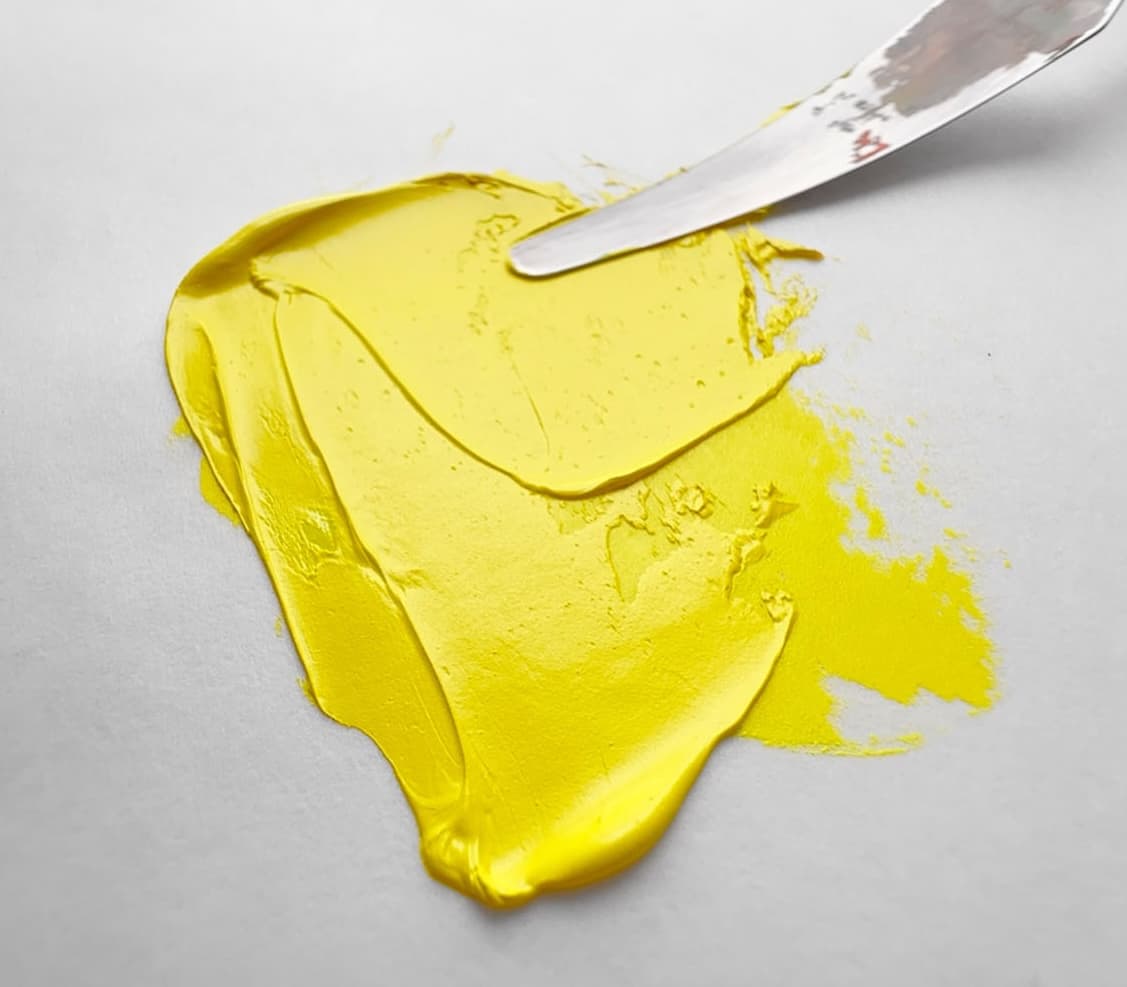 A bit of yellow oil paint made with cadmium yellow