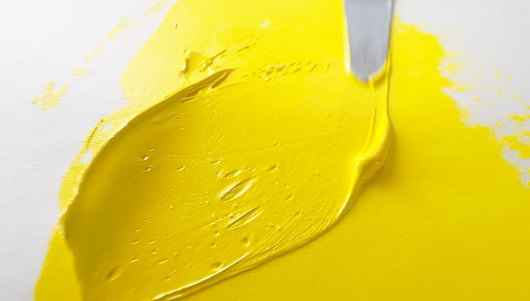 A dollop of yellow oil paint made with PY35